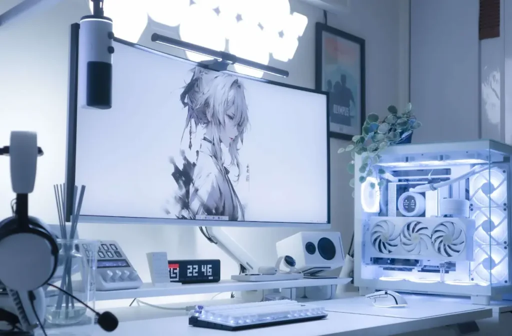 Monitor gamer branco em setup moderno.